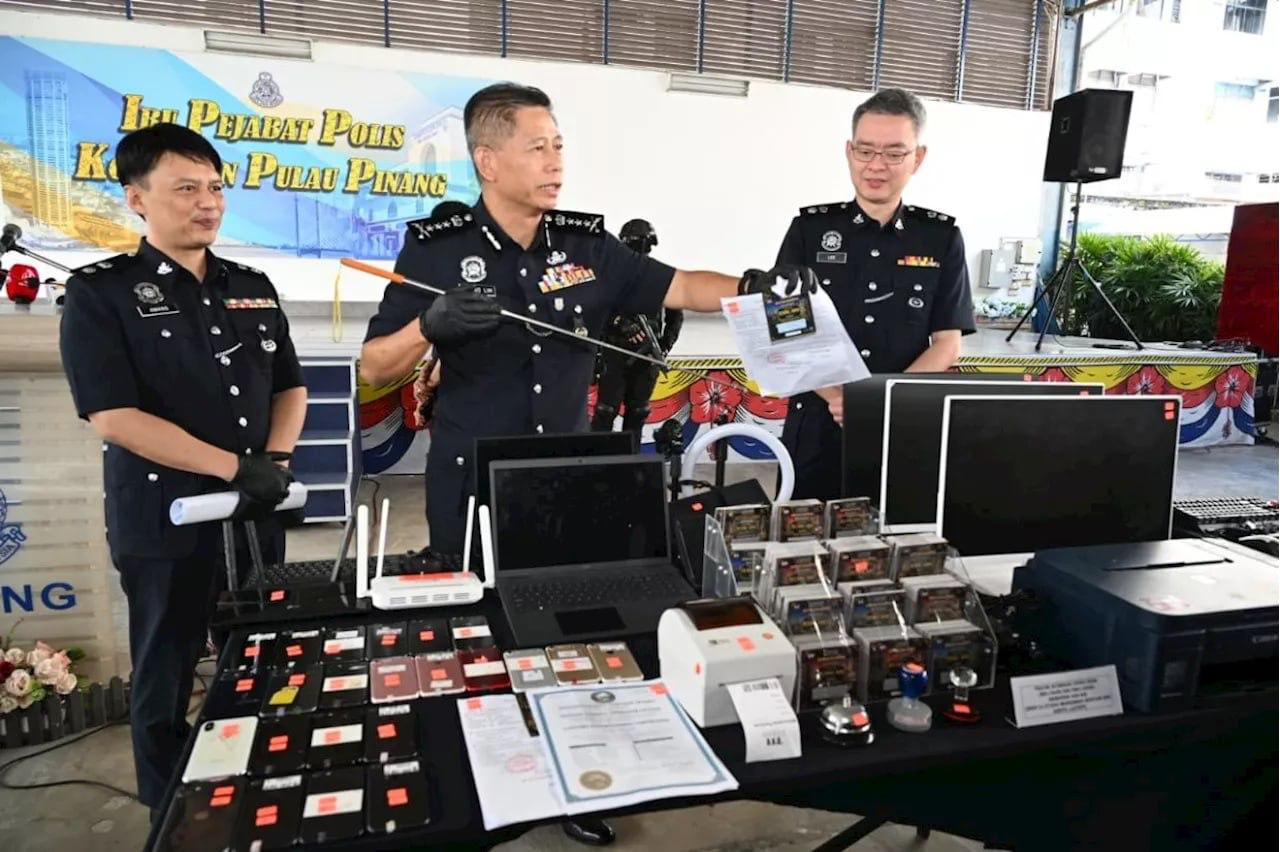 #马来新闻 槟城连端3个“刮刮乐”诈骗窝点 29人落网其中1-manila58.com